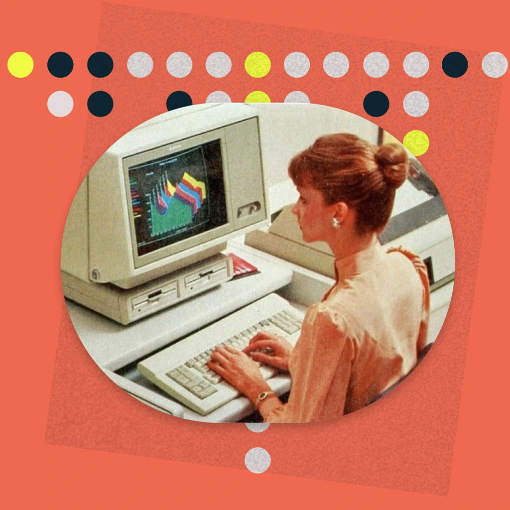Lady with blondey brown hair viewing charts on a very old computer