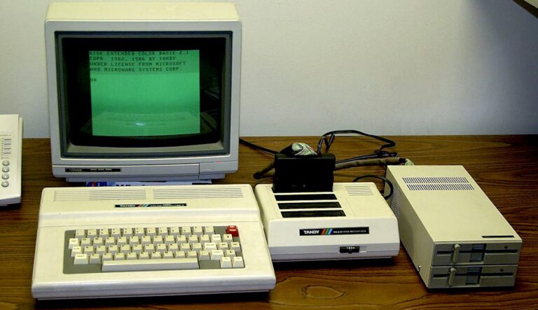 1980s computer system and setup on a wooden desk