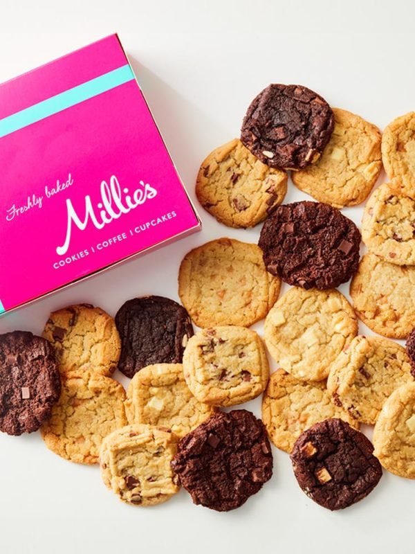 Millie's Cookies branded box with a selection of cookies in a heart shape.
